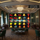 A premium online slot machine interface showing frequent small wins with classic fruit symbols, a visible session timer, and a positive bankroll indicator, representing extended low volatility gameplay.
